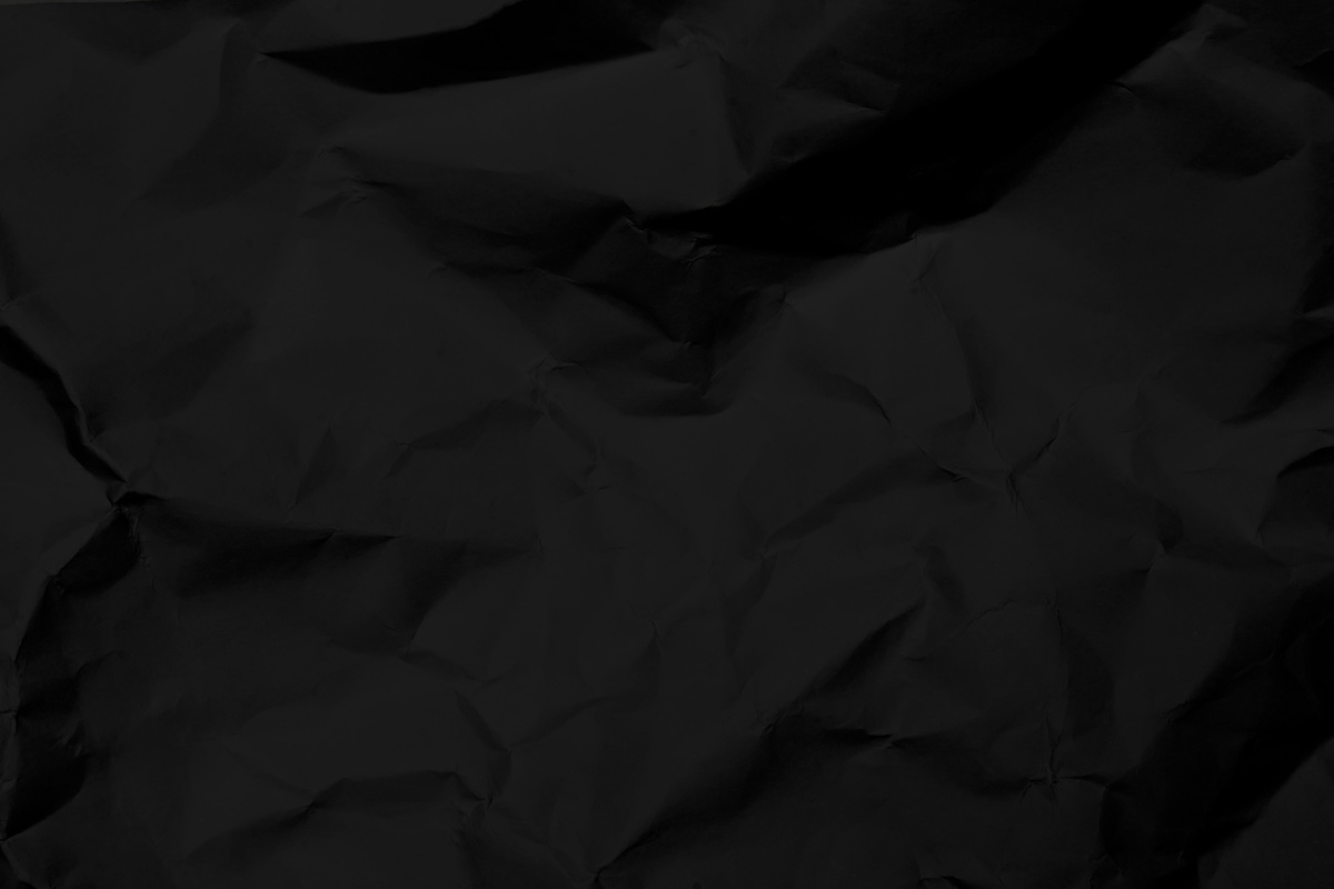 Black Crumpled Paper Textured Background